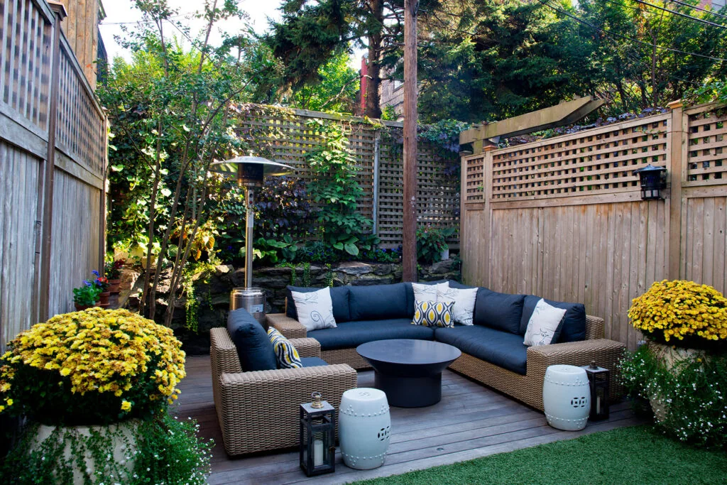 Outdoor deck with seating beside a home