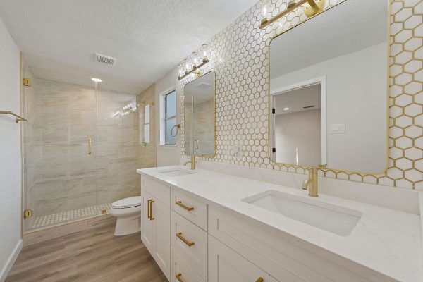 a home bathroom with white finishings